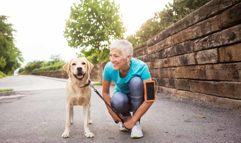 woman-active-55-walking-dog woman-active-55-walking-dog