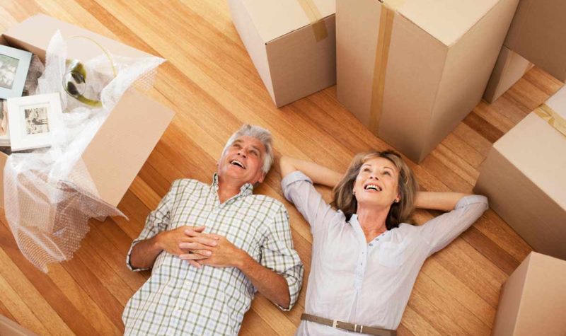 couple-downsize-moving-boxes couple-downsize-moving-boxes