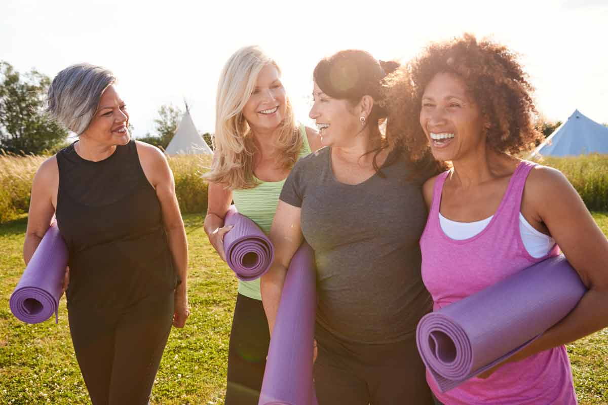 women-friends-yoga-mats